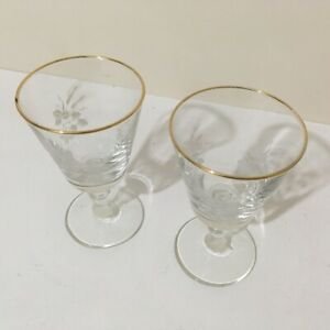 Vintage pair of etched wine glasses with gold gilded rims